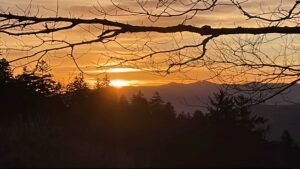 Sunrise over the Smoky Mountains, symbolizing a new beginning and overcoming self-doubt. Ignite confidence as a writer with these practical tips and strategies.